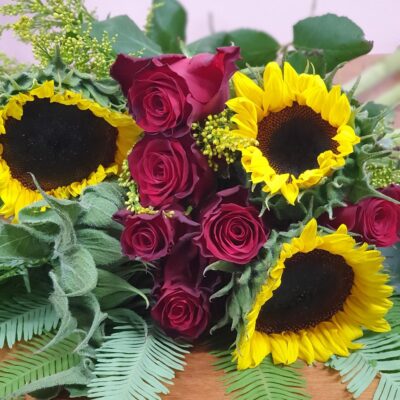 Nothing is more happy than sunflowers. So this bouquet will make anyone smile and lets add some roses for an even better results.