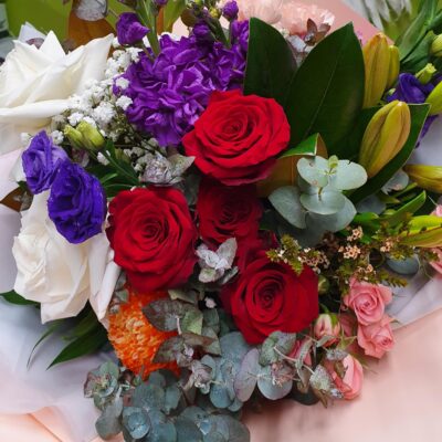 Seasonal flowers with roses all put beautiful together in a bouquet.